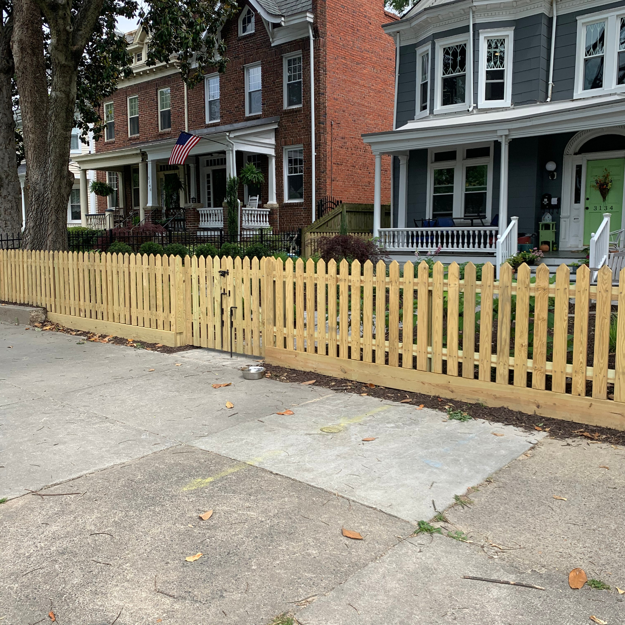 4 foot high 45 degree pointed wood picket fence.