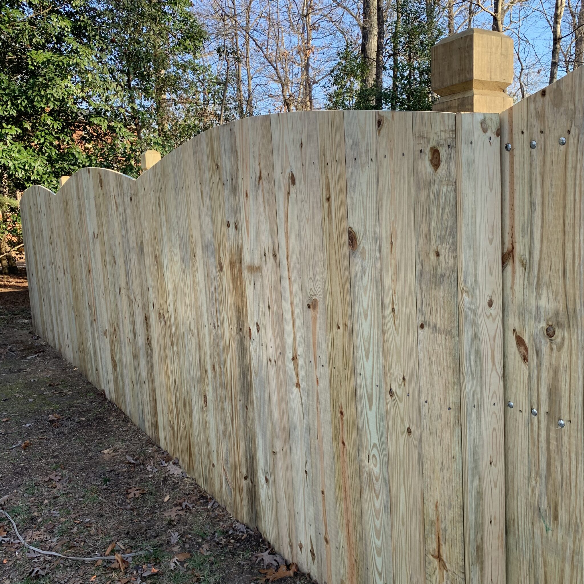 6 foot wood privacy fence with beveled and notched posts.