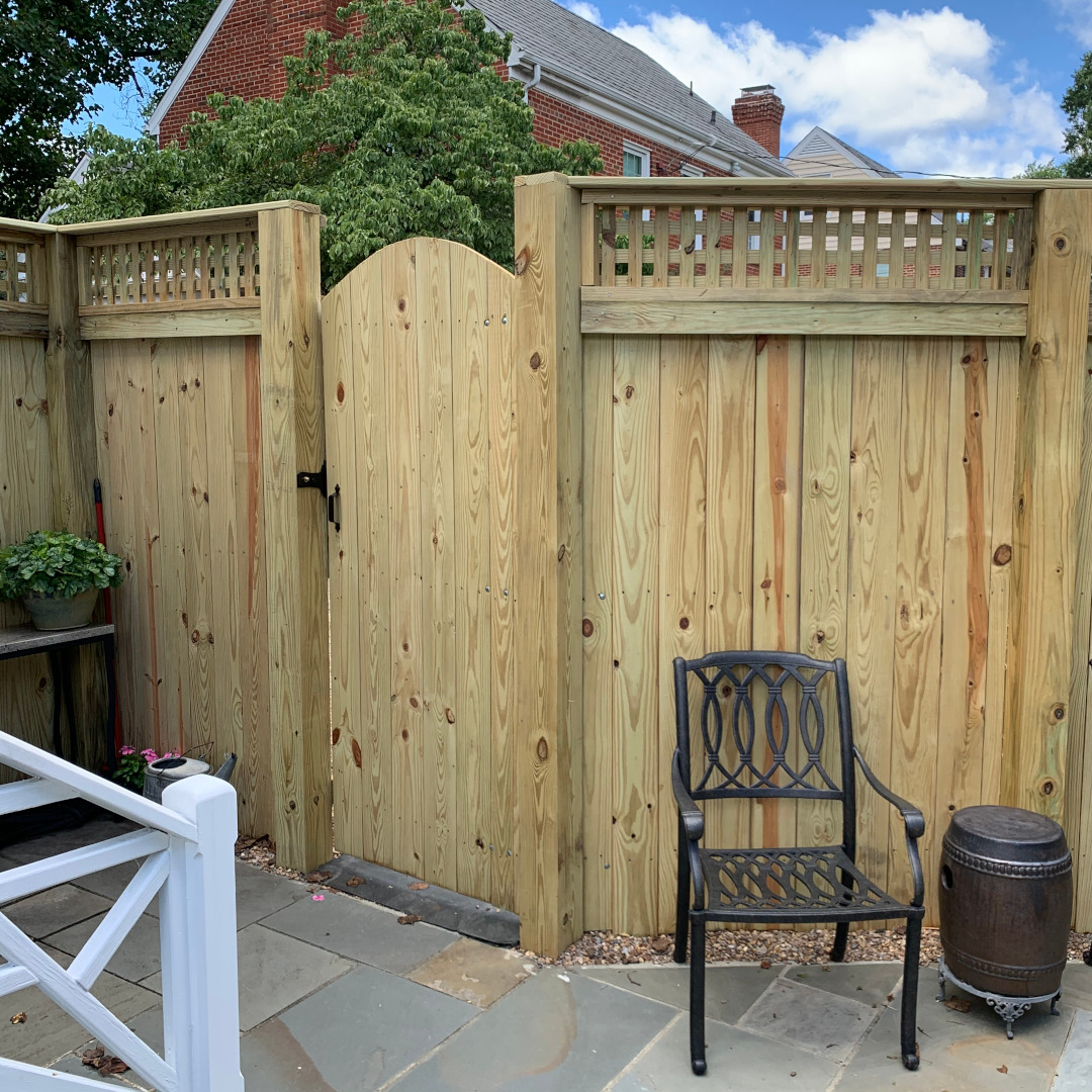 Unique 7' 7" tall wood privacy fence with horizontal lattice and an arched gate.