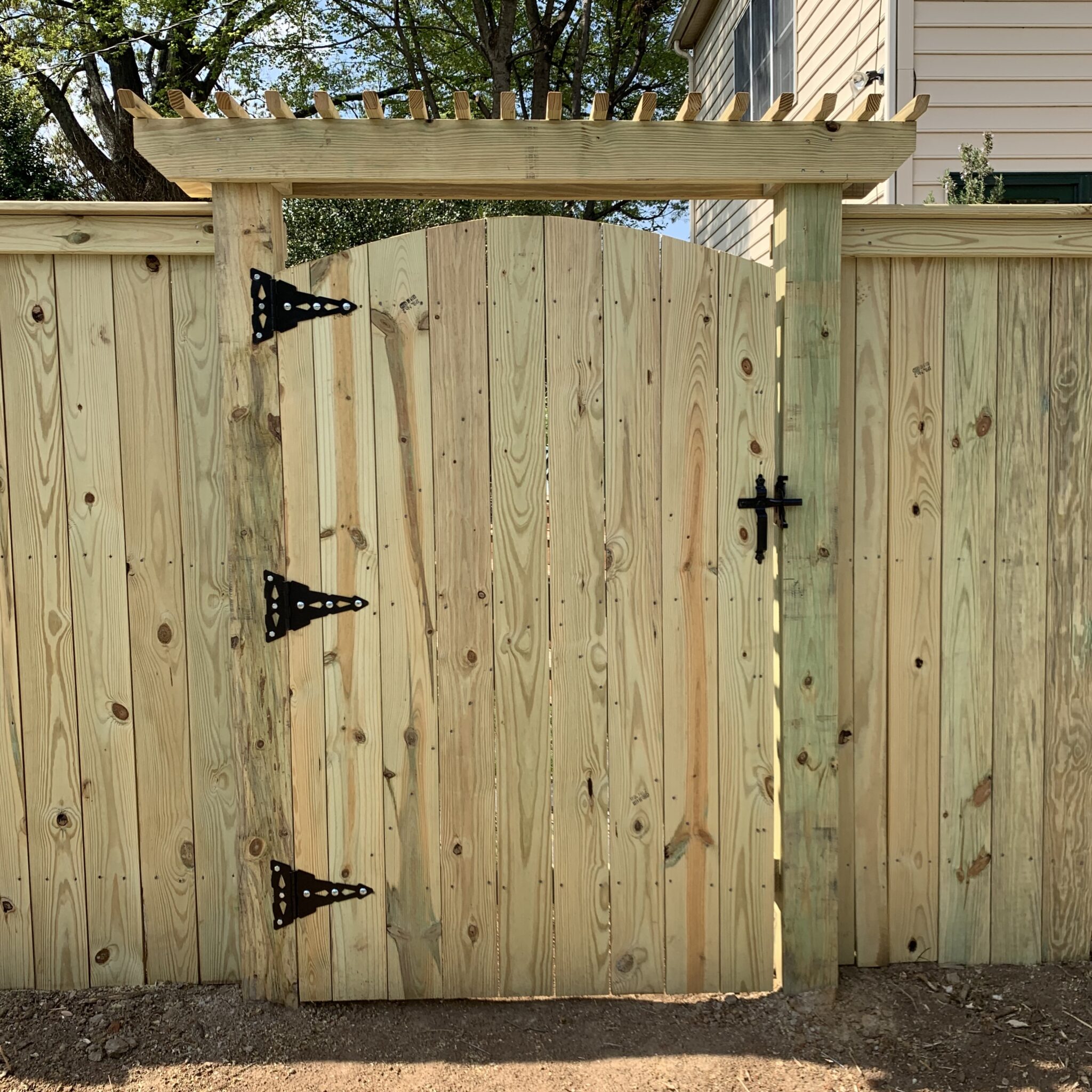mini arbor and gate in wood privacy fence