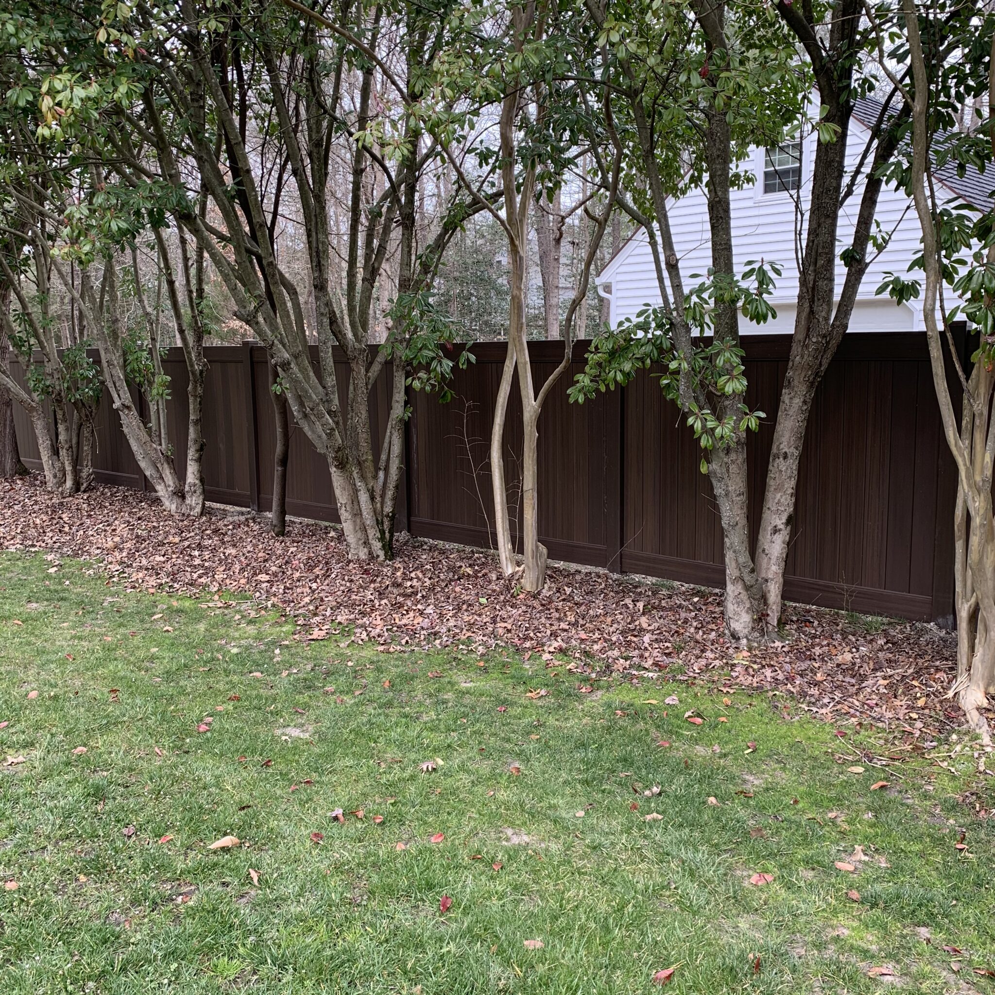Brown vinyl privacy fence