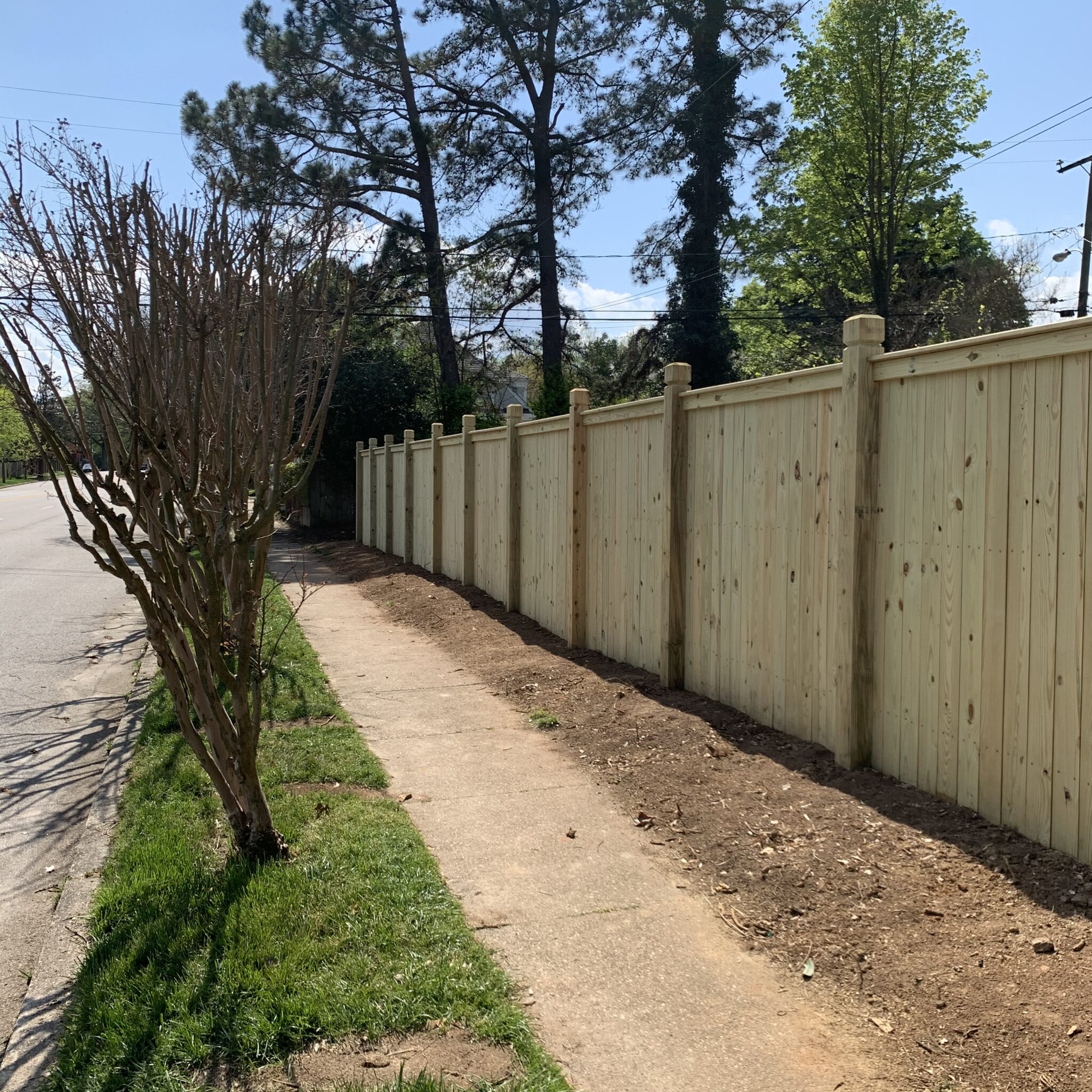 wood privacy fence with exposed 6×6 posts