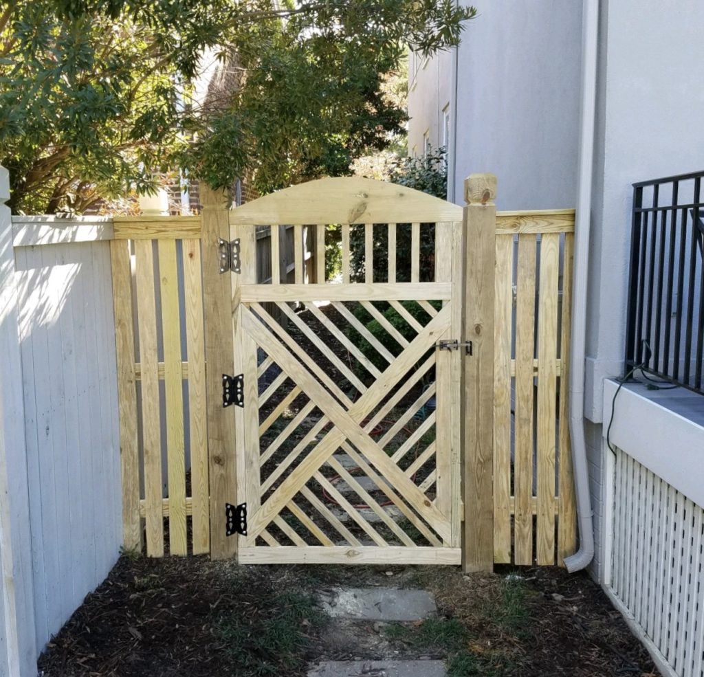 Chippendale style wood privacy gate.