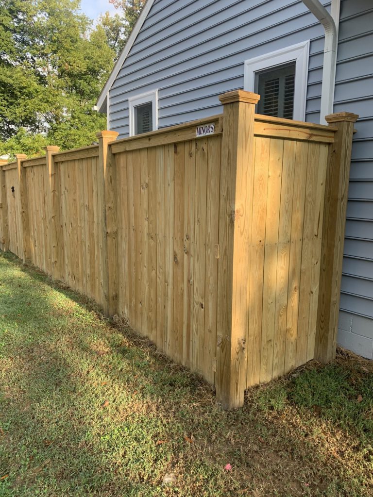 wood privacy fence with top cap and finish boards