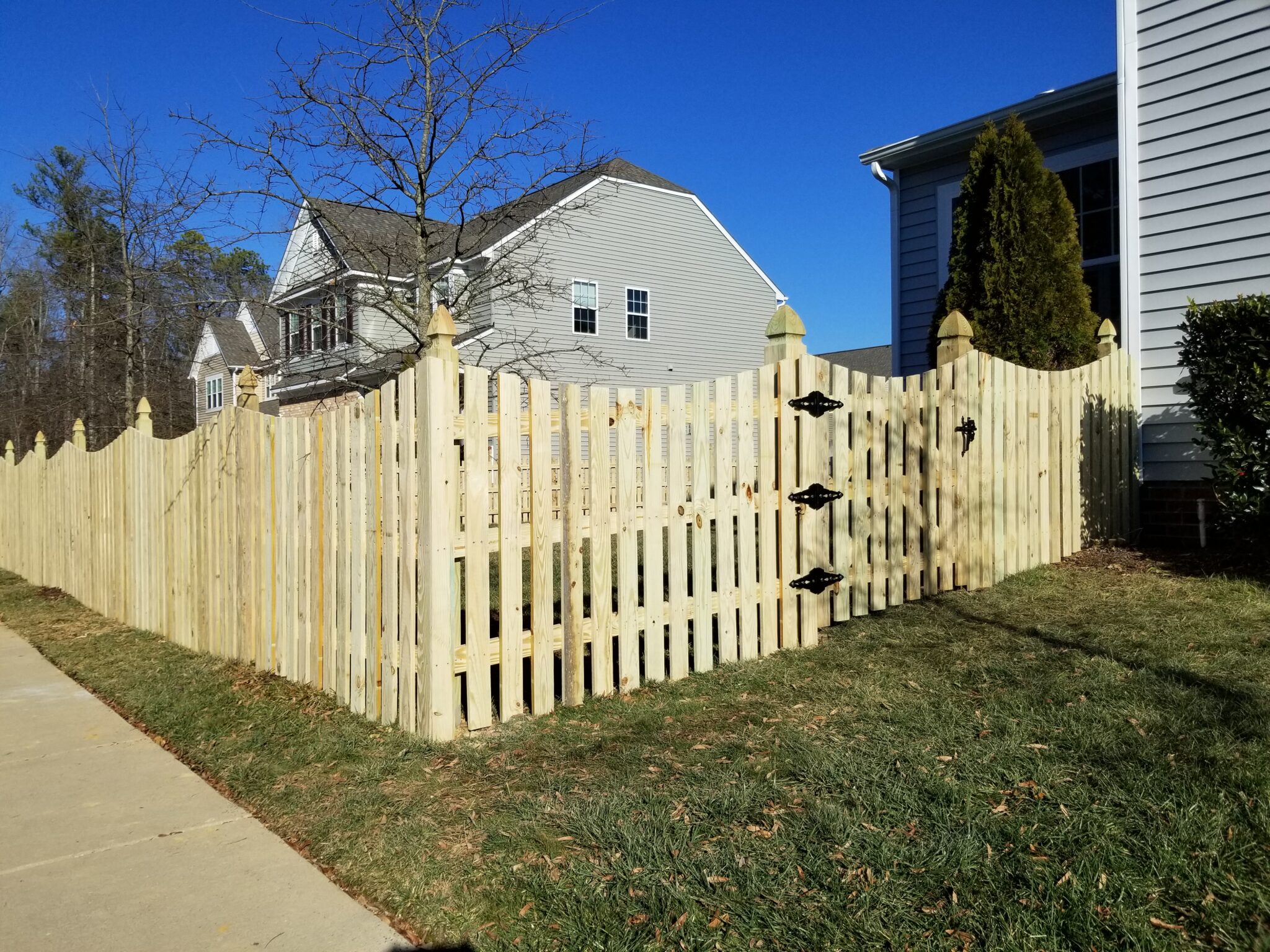 wood picket fence with french gothic posts