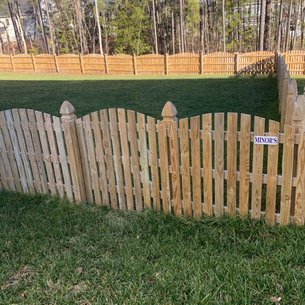 wood picket fence that features 1.5" spacing and french gothic posts